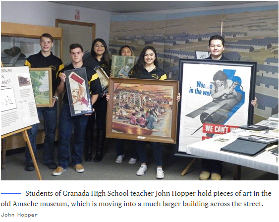 Students of Granada High School teacher John Hopper hold pieces of art in the old Amache museum